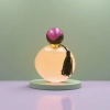 The pink round perfume bottle is equipped with a purple-black double-color ball-shaped cap and black tassels for decoration details Picture